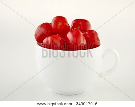 Ripe, Red Cherry Tomatoes Of The Confetto Variety.isolate.white Background