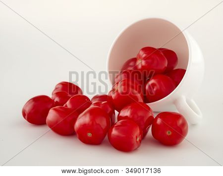 Ripe, Red Cherry Tomatoes Of The Confetto Variety.isolate.white Background