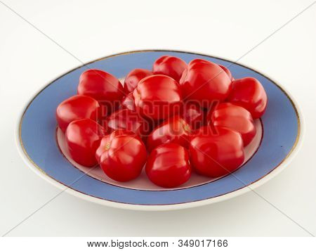 Ripe, Red Cherry Tomatoes Of The Confetto Variety.isolate.white Background
