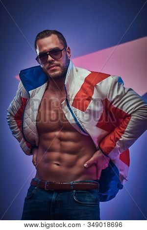 Muscular Man Is Demonstraiting His Perfect Abs Wearing Jacket And Sunglasses.