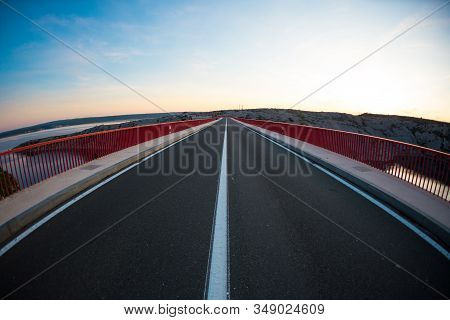 Red Bridge Over The Canyon In Croatia At Sunset. View From The Bridge To The Canyon In The Krka Nati