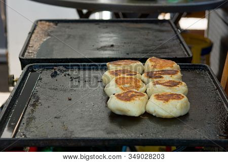 Delicious Fried Bread On A Grill Plate.