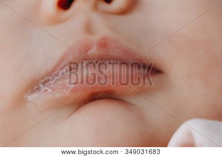 Portrait Of A Healthy And Well-groomed 3-month-old Baby With Saliva In Close-up. A Newborn Baby Girl