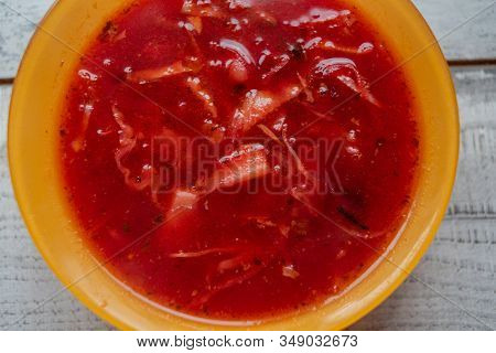 Traditional Ukrainian Russian Vegetable Borscht On The Old Wooden Background. Borscht. Borsch With Q