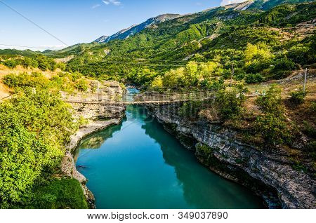 Old Broken Wooden Bridge Over Aoos River Near Permet In Albania
