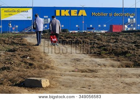 Bucharest, Romania - January 13, 2020: An Elderly Couple Goes On A Bad Road To The Ikea Bucharest Ba
