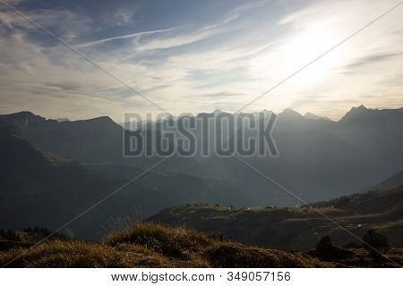 Mountain Chain On A Misty And Sunny Evening