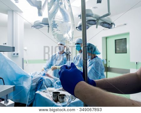 Arthroscope Surgery. Orthopedic Surgeons In Teamwork In The Operating Room