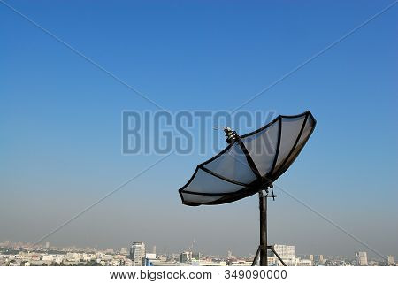 Satellite Dish On Rooftop Installed For Receiving Signal Television And Communication Technology Wit