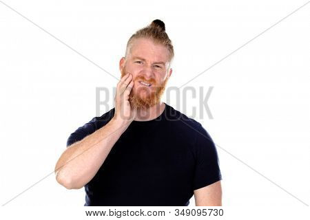 Red haired man with long beard with toothache isolated on a white background