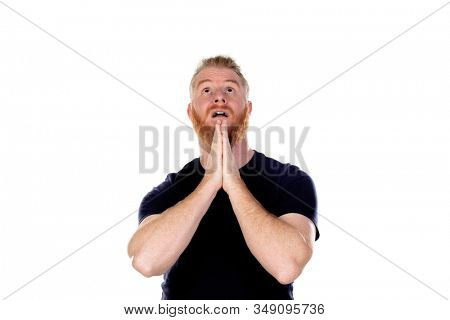 Red haired man with long beard praying isolated on a white background