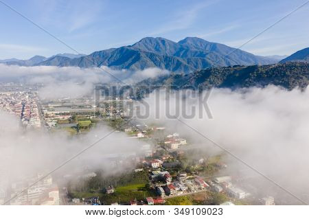 Puli, Nantou - Jan 2nd, 2020: aerial view of Puli cityscape with clouds over the city, Nantou county, Taiwan