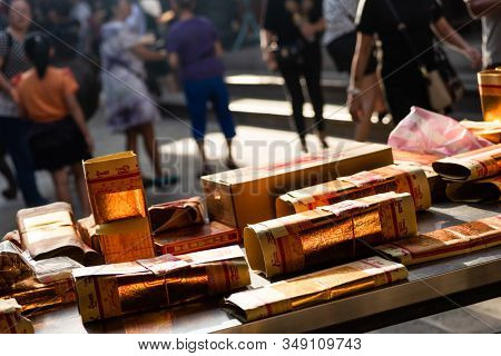 Yunlin, Taiwan - July 13th, 2019: chinese joss gold paper craft on a table at Beigang Chaotian Temple, Yunlin, Taiwan, Asia