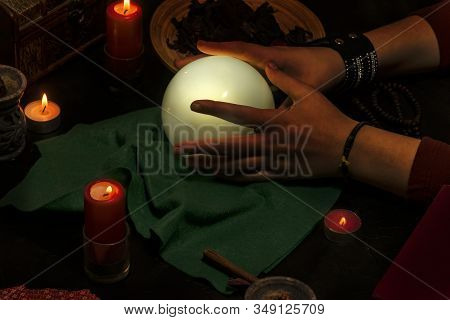 Astrology Concept. Pythoness Reading The Future In Her Hand On A Crystal Ball.