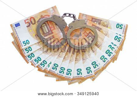 Handcuffs On The Background Of Euro Isolated On A White Background. Fan Of 50 Euro Banknotes. Euro M
