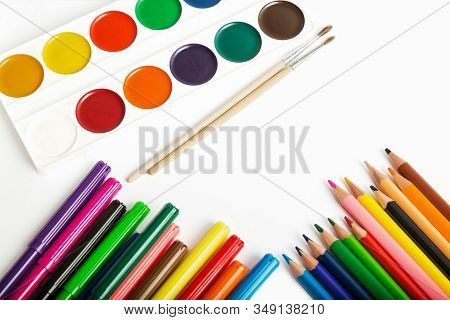 Set Of Tools For Painting - Colored Pencils, Felt-tip Pens, Watercolor Paints And Brushes Close-up O