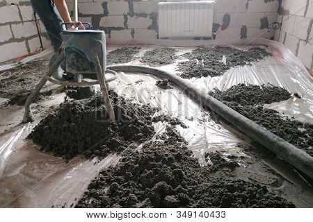 Construction Site - Machine Floor Screed, Pipes For Heating And Floor Heating.