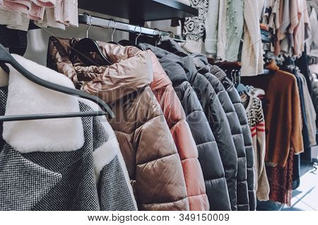 Sustainable Living, Zero Waste Wardrobe. Secondhand Fashion. Various Clothes On Hangers On Shelves A