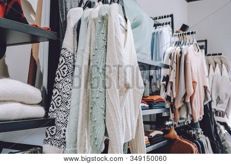 Sustainable Living, Zero Waste Wardrobe. Secondhand Fashion. Various Clothes On Hangers On Shelves A