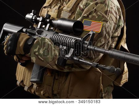 Front View Of Incognito Military Officer Holding Sniper Rifle. Crop Of American Soldier In Uniform A