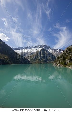 Lake At The Goescheneralp (goescheneralpsee) On A Sunny Day