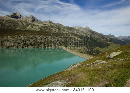 Dam At The Goescheneralp In The Central Swiss Mountatins