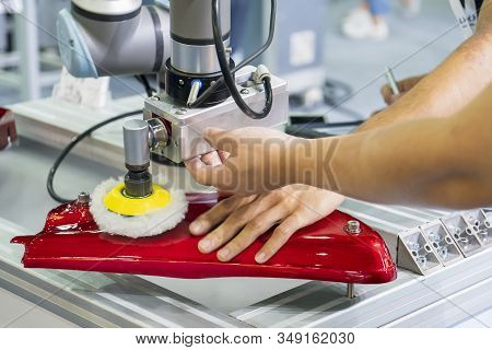 The Engineer Setup And Teaching  The Automatic Polishing Robotic System In The Automotive Assembly L