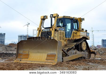 08.11.2019 Minsk, Belarus: Track-type Bulldozer Caterpillar D6T , Earth-moving Equipment Background