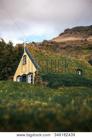 Historic Turf Church Hofskirkja In The Small Icelandic Village Of Hof, Iceland