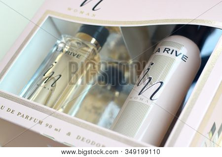 La Rive In Woman Deodorant And Perfume Bottles In Brand Box On Beige Background. La Rive S.a. Is One