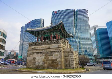 Seoul, Republic of Korea - March 2019: Dongshipjagak, ancient watchtower, Seoul landmark. Modern office buildings in the background.