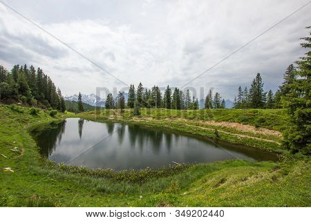 Lake Flesch On A Cloudy Day In The Swiss Mountains