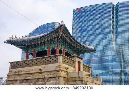 Seoul, Republic of Korea - March 2019: Dongshipjagak, ancient watchtower, Seoul landmark. Modern office buildings in the background.