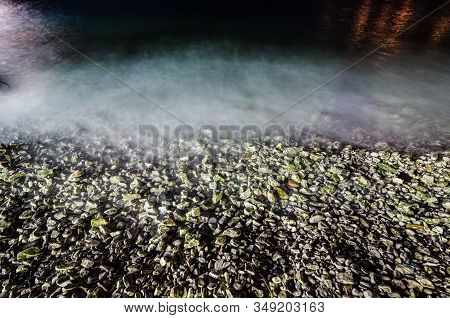 Coast Of The Sea In Sarande With Stones At Night On Long Exposure