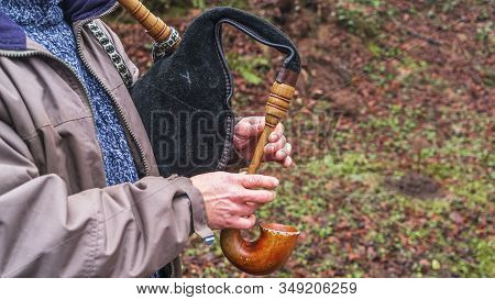 Musician Hands, Playing On Belarusian Traditional Bagpipes, Duda On The Nature Background.