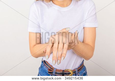 Elderly Woman Suffering From Pain, Weakness And Tingling In Wrist. Causes Of Hurt Include Osteoarthr