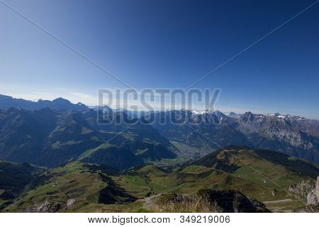 Reuss Valley On A Sunny Day With Mountains In The Background In Central Switzerland
