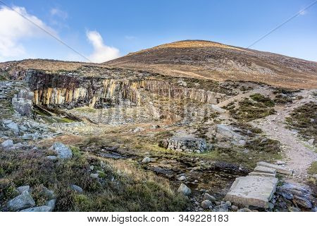 Old Stone Quarry In Mourne Mountains On The Hill Of Slieve Donard Mountain. This Mountain Range Is T