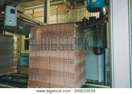 Wrapping A Transport Film Of A Brick Pallet. Brick Production, Hollow Ceramic Bricks Factory. Brick 