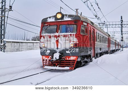 Perm, Russia - February 01, 2020: Ice Covered Passenger Electric Multiple-unit Train At Winter Railw