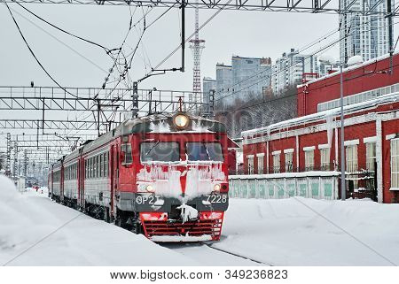 Perm, Russia - February 01, 2020: Ice Covered Passenger Electric Multiple-unit Train At Winter Railw