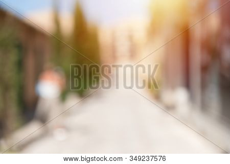 Defocused Abstract Background Of Urban City In Sunny Day, Vertical. Deserted Street