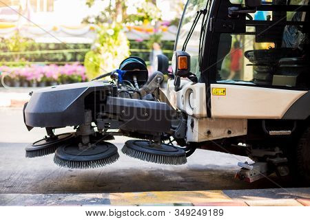 The Special Car Cleans City Road. Detail Of A Street Sweeper Machine. Car Cleaning The Road.