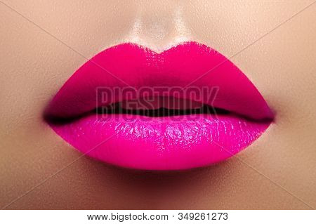 Cosmetics, Makeup. Bright Lipstick On Lips. Closeup Of Beautiful Female Mouth With Fashion Pink Lip