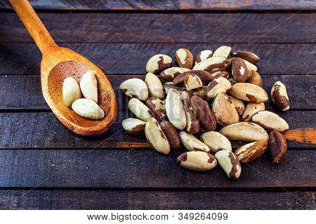 Peeled Brazil Nut. Brazil Nuts, Rustic Wood Background. The Chestnut Is The Seed Of The Chestnut Tre
