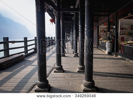 Yichang, Hubei / China - Dec 25 2019:  The Wooden Village Along With The Hill Beside The Yangtze Riv