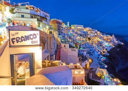 Thira, Santorini, Greece - April 23, 2018: Thira town in Santorini at night