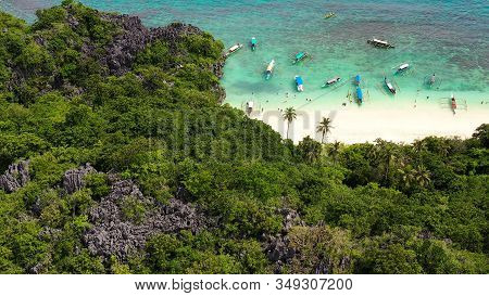 Sandy Beach With Tourists And Tropical Island By Atoll With Coral Reef, Top View. Lahos Island, Cara