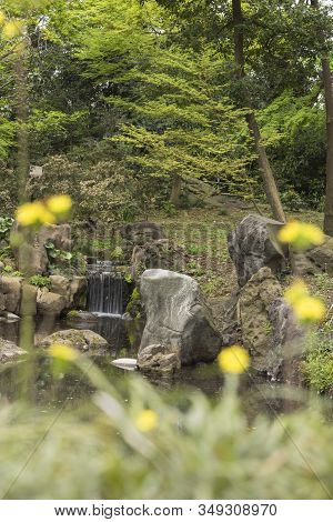 Takemi Teahouse Waterfall Seen From The Chidori Wooden Bridge Lined With Flowers Located In The Riku