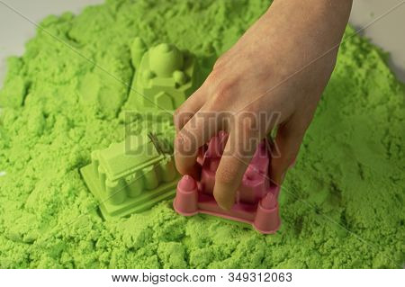 Kinetic Sand. A Child Plays With Kinetic Sand. Fine Motor Skills, Creativity, Games